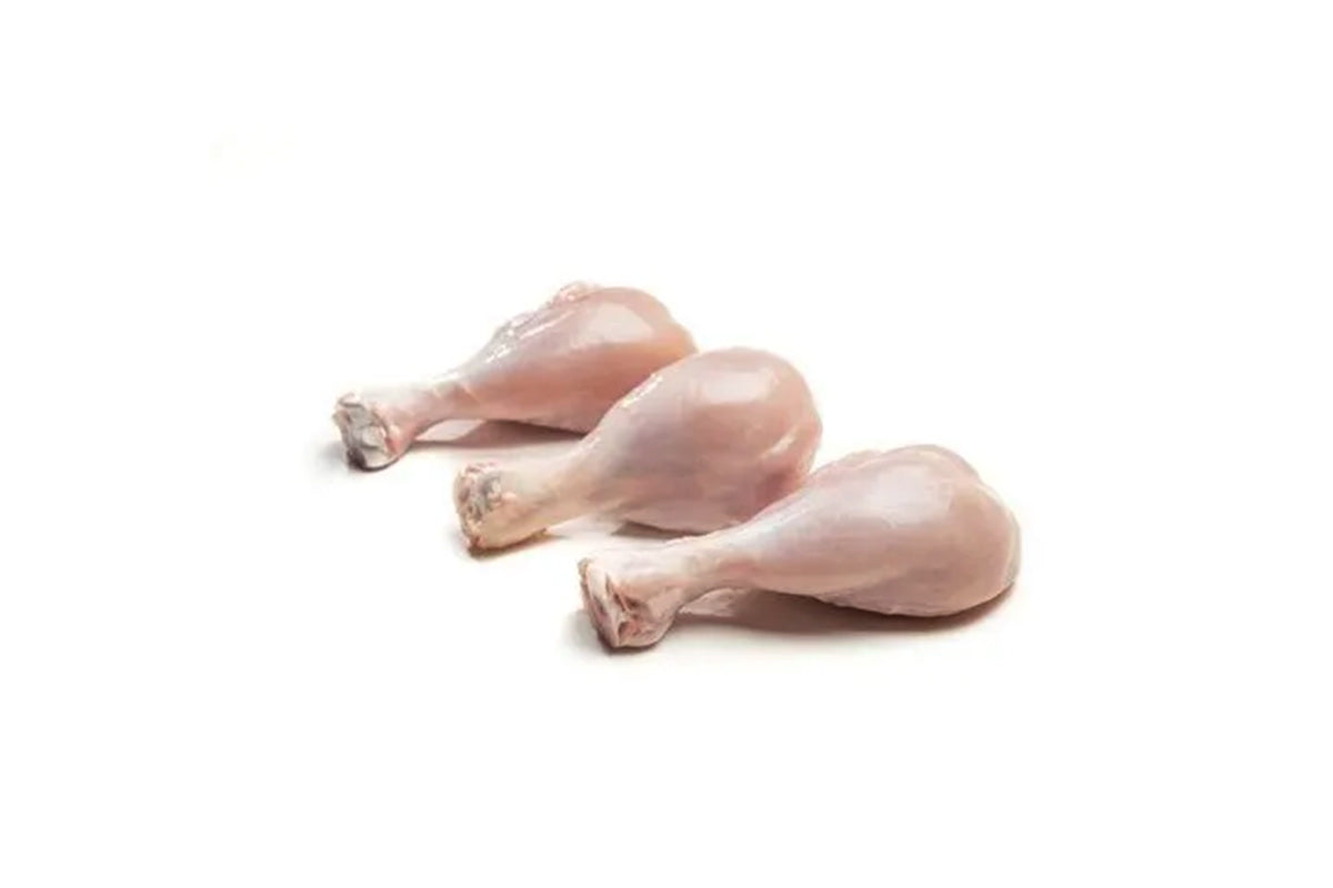 A pack of five fresh skinless chicken drumsticks on a white background.