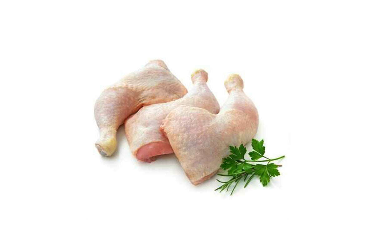 A pack of 5 raw chicken legs on a white background, accompanied by a small sprig of parsley.